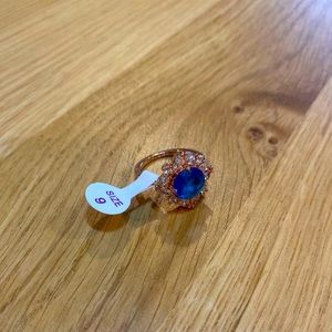 Rose Gold ring with Blue and White gems